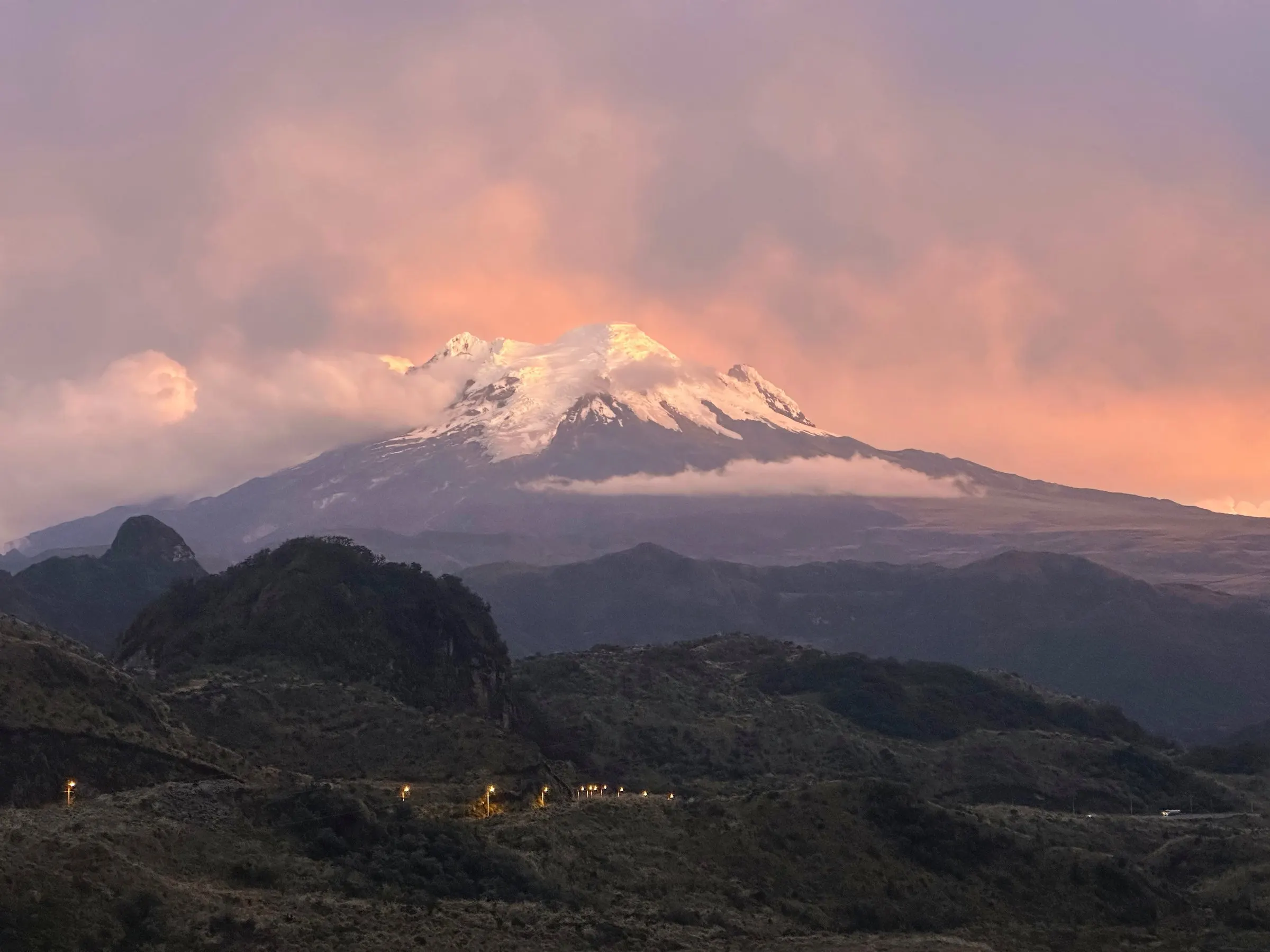 Antisana at dusk under a cold sky, seen from the Papallacta pass